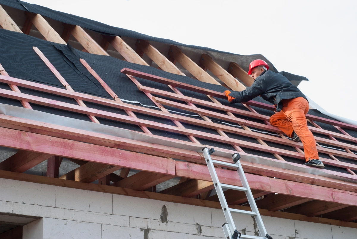 Roofing contractor on rooftop