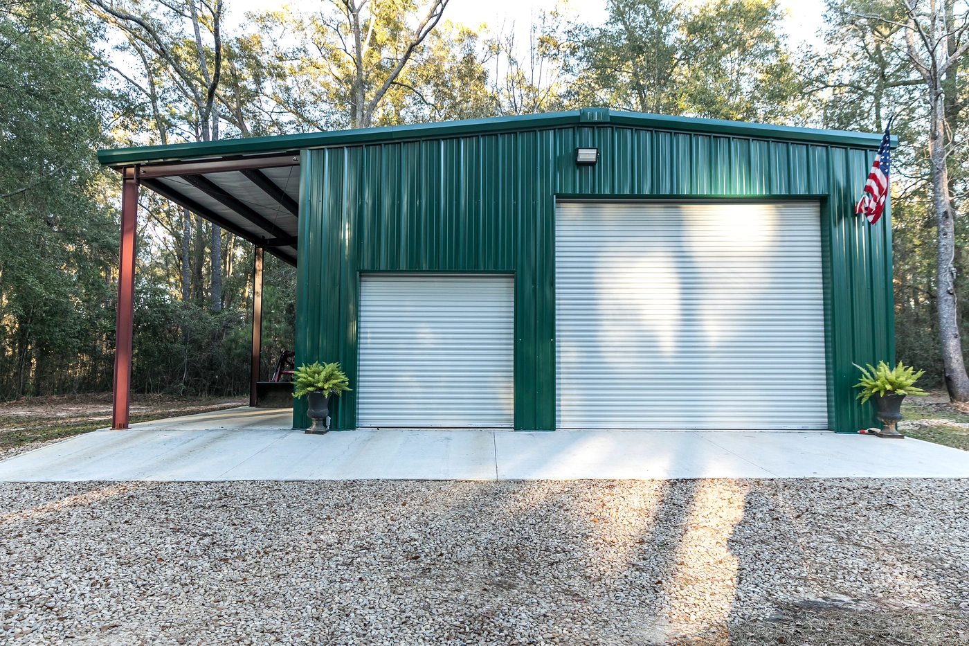 garage with green metal siding and roofing