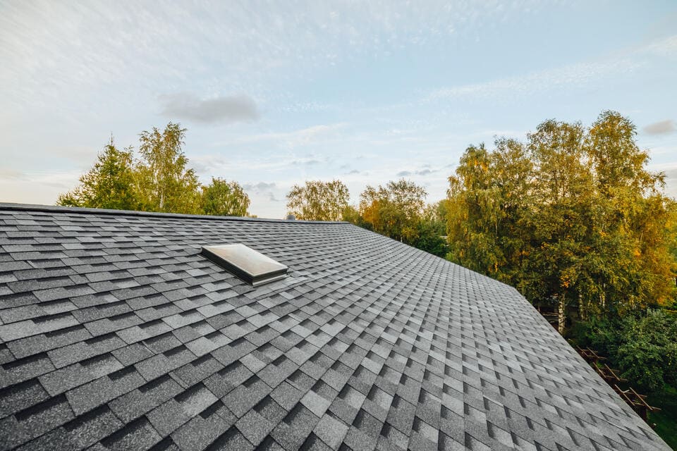 close up of gray architectural shingles on a home after storm damage repairs