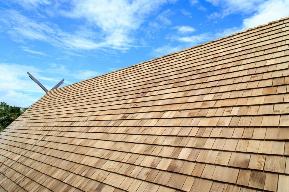 close up of new cedar shingles on a house roof