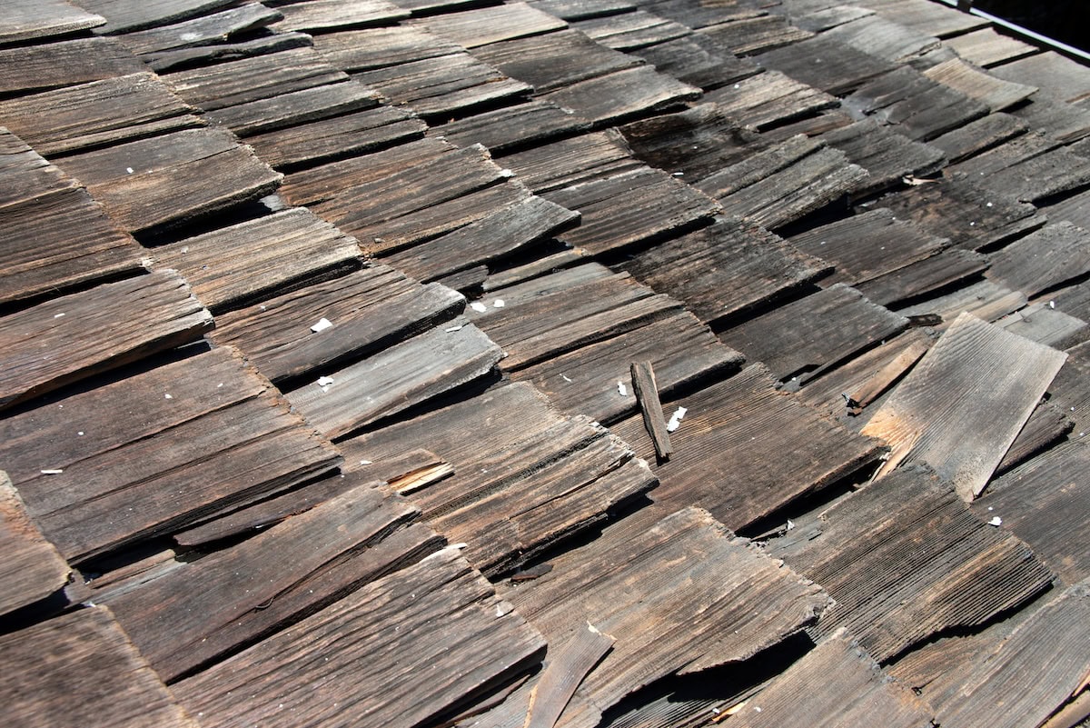 Wood shake shingles broken due to hail damage