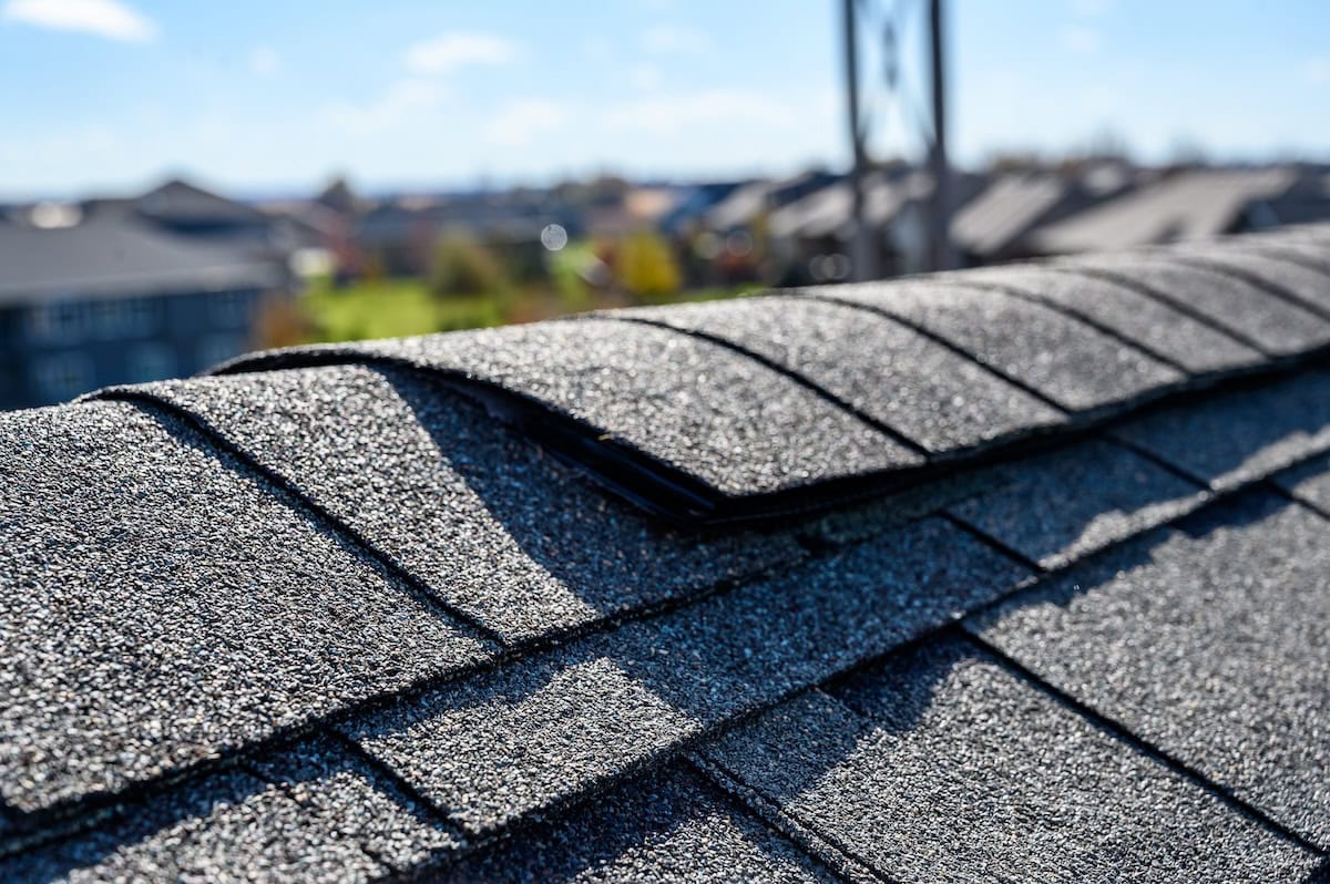 Asphalt shingle room with ridge cap