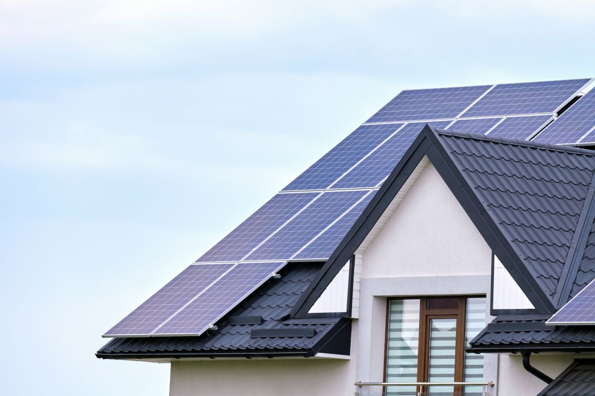 solar panel roofs dark blue metallic tiles and white wall